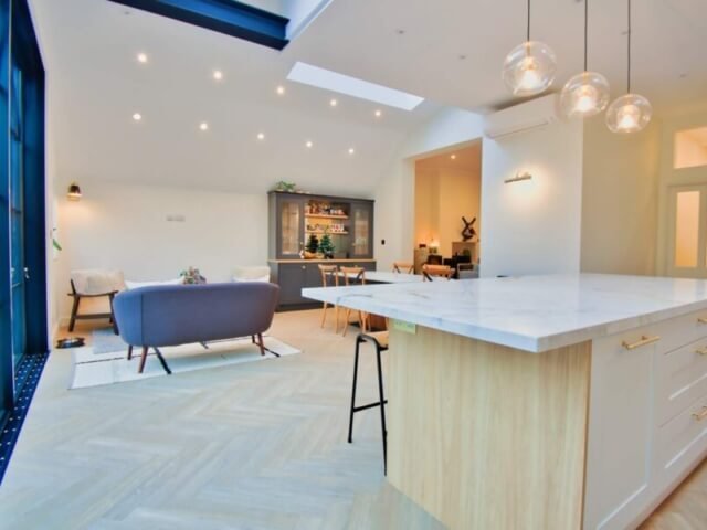 open concept kitchen with island and stool